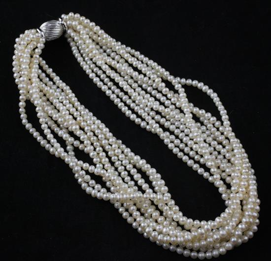 A modern multi-strand cultured pearl necklace with 14ct white gold fluted clasp, 17in.